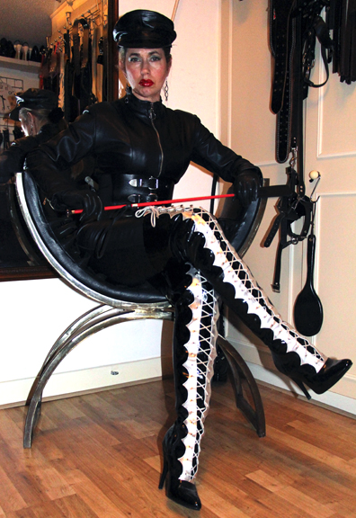Mistress thigh high boots using slave images
